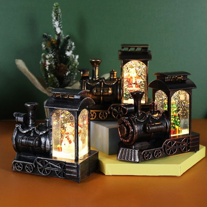 Decoratiune de Craciun tip locomotiva, glob de cristal cu fulgi de zapada, model Mos Craciun, iluminare LED, 11.5 x 12.5 x 6 cm, muzical, maro