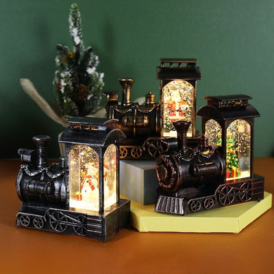 Decoratiune de Craciun tip locomotiva, glob de cristal cu fulgi de zapada, model Mos Craciun, iluminare LED, 11.5 x 12.5 x 6 cm, muzical, maro
