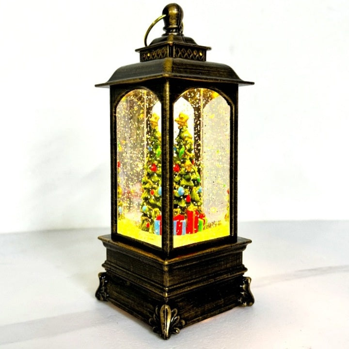 Decoratiune luminoasa si muzicala cu tematica de Craciun, tip felinar, cu brad impodobit si cadouri, din metal si plastic, maro