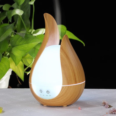 Difuzor aroma cu ultrasunete, lumini LED 7 culori, autonomie 6h, telecomanda, programabil, capacitate 200 ml, lemn deschis