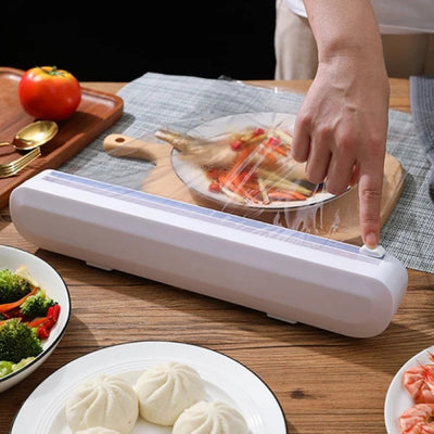 Dispenser pentru folia alimentara cu lama de taiere, dimensiuni 37 x 6.2 x 5.2 cm, buton de taiere in doua directii, ventuze de prindere, alb
