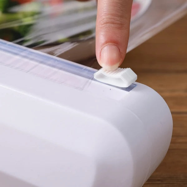 Dispenser pentru folia alimentara cu lama de taiere, dimensiuni 37 x 6.2 x 5.2 cm, buton de taiere in doua directii, ventuze de prindere, alb