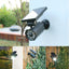 Lampa solara, tip camera video, cu senzor de miscare, lumina LED, telecomanda, acumulator, negru