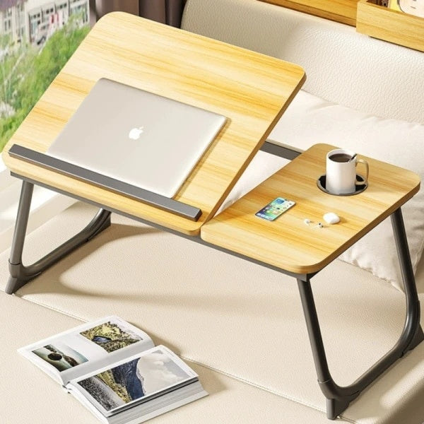 Masa pliabila pentru laptop, cu suport pentru pahar, reglabila pe inaltime 5 pozitii, dimensiuni 55.3 x 24 x 32 cm, greutatea maxima suportata 45 kg, lemn deschis