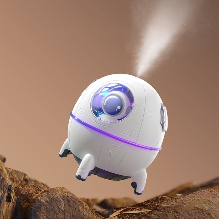 Mini umidificator, tip nava cu astronaut, portabil, cu 7 tipuri de lumina ambientala, alimentare USB C, alb