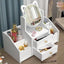Organizator cosmetice, cu sertar si oglinda, cu 4 compartimente, din plastic si ABS, impermeabil, alb