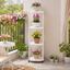Suport multifunctional pentru flori si plante, cu 4 niveluri si roti, metalic, interior si exterior, alb