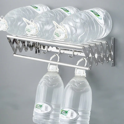 Suport pliabil pentru prosoape, din inox, cu 7 bare, 5 carlige, dimensiuni 12-35.5 cm x 58 cm x 14.5 cm, fixare pe perete, argintiu