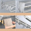 Suport pliabil pentru prosoape, din inox, cu 7 bare, 5 carlige, dimensiuni 12-35.5 cm x 58 cm x 14.5 cm, fixare pe perete, argintiu